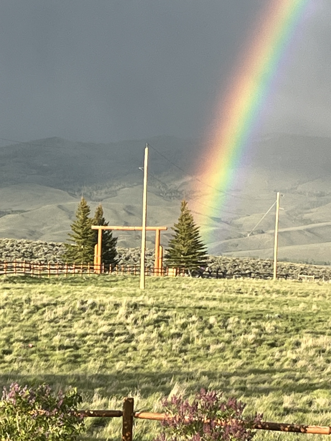 Close view of rainbow over the ranch entrance